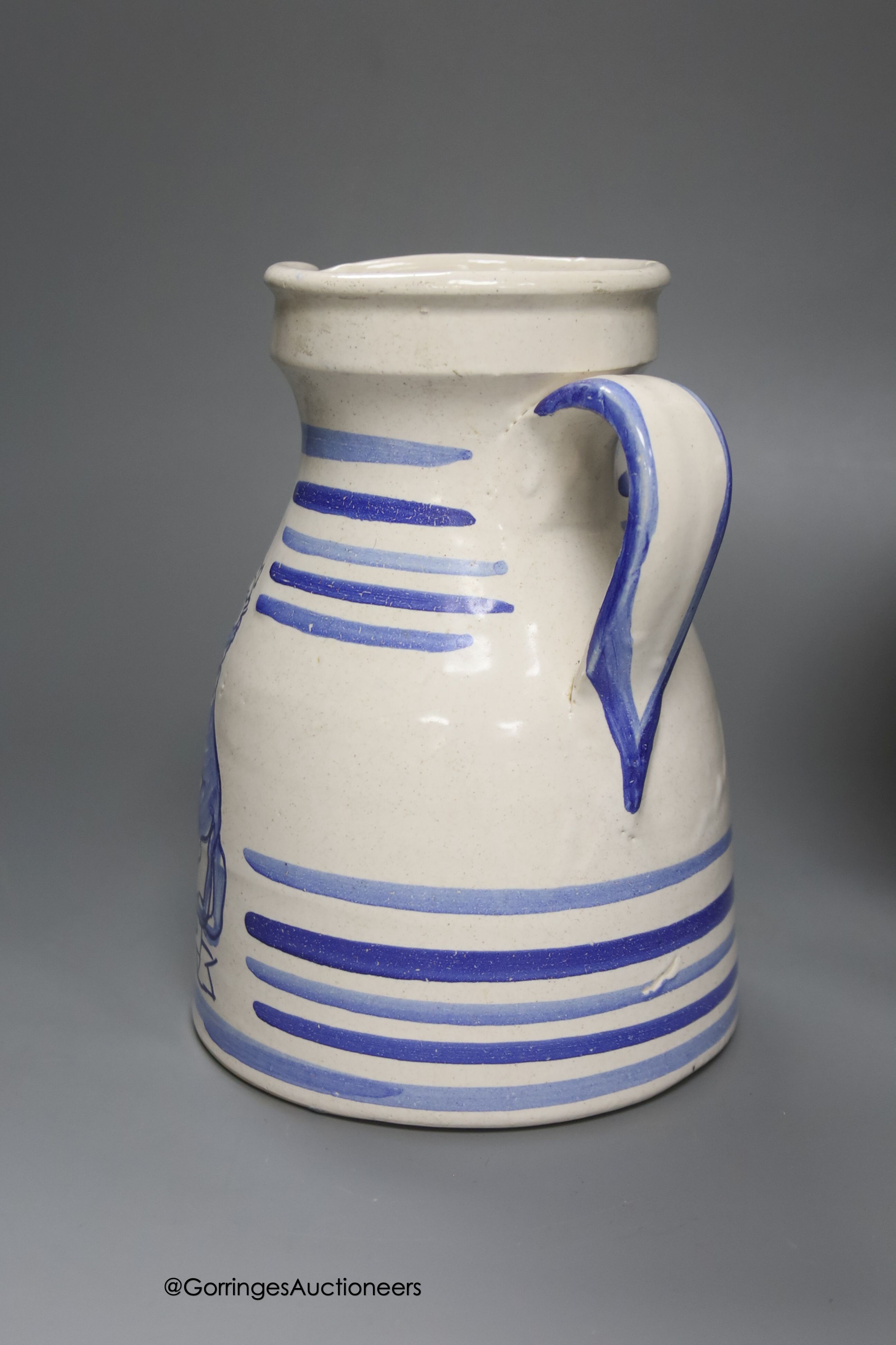 A tin-glazed terracotta barber's bowl dated 1819, a large ovoid eathenware ‘Taback’ jar and three earthenware jugs